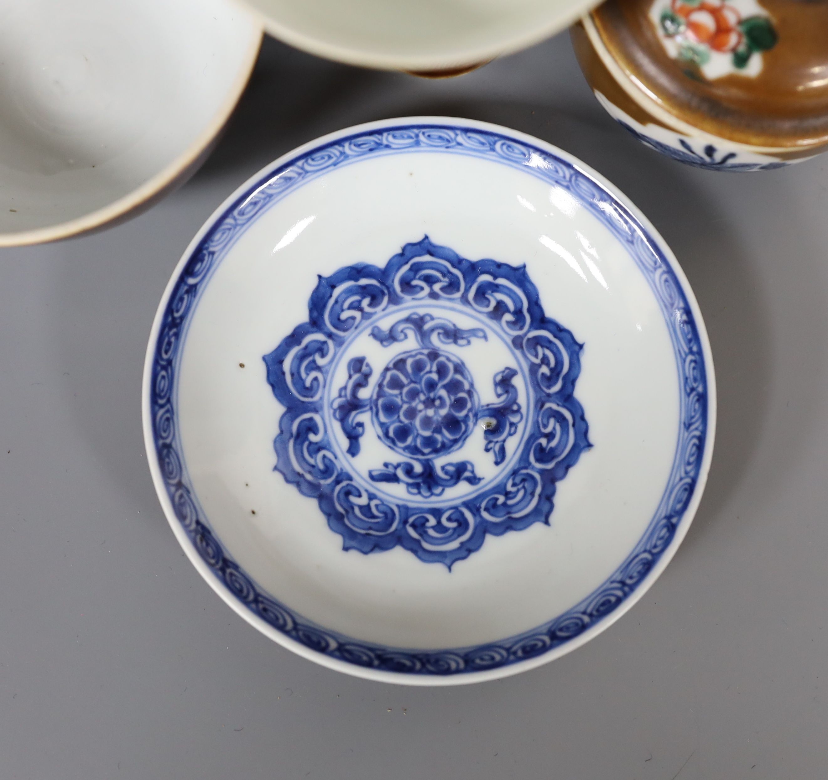 A Chinese cafe au lait glazed saucer, three bowls and a stem cup